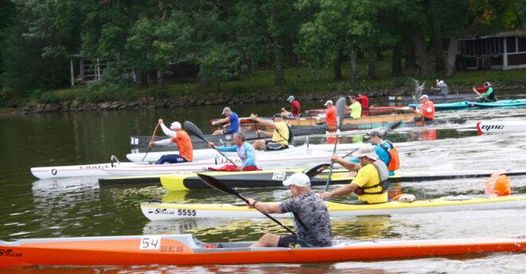 A group of people paddling on boats